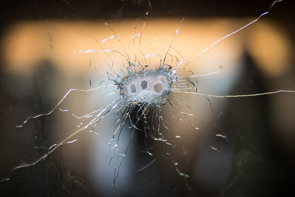 Bullet holes in a front windshield: How to Win an Assault Case with a Weapon