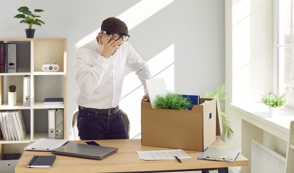 Employee facing job loss due to sexual assault charges in Canada, worried about career consequences.